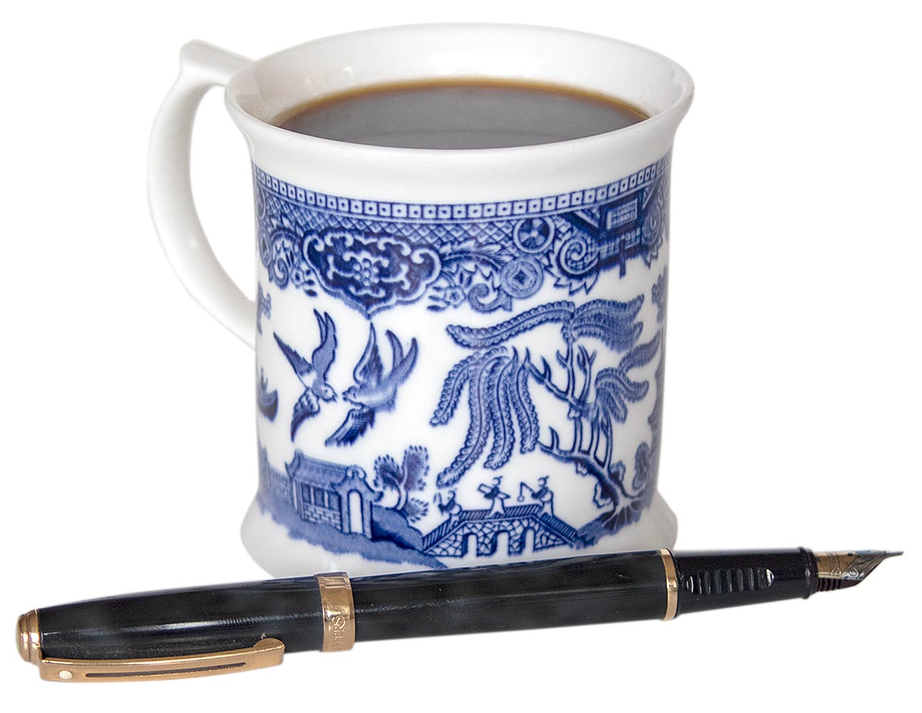 Mug of coffee with a fountain pen.